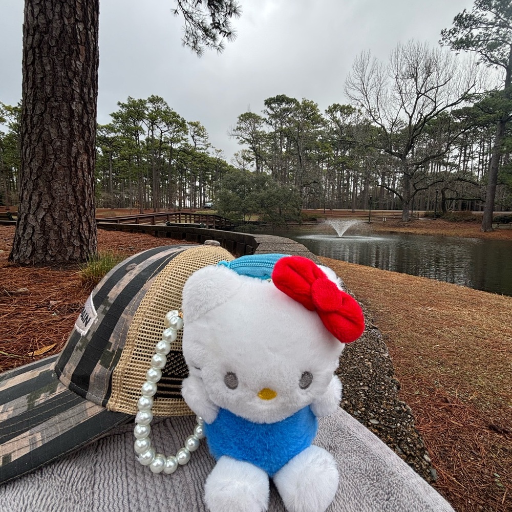 Hello Kitty Plush Toy with Red Bow and Blue Outfit